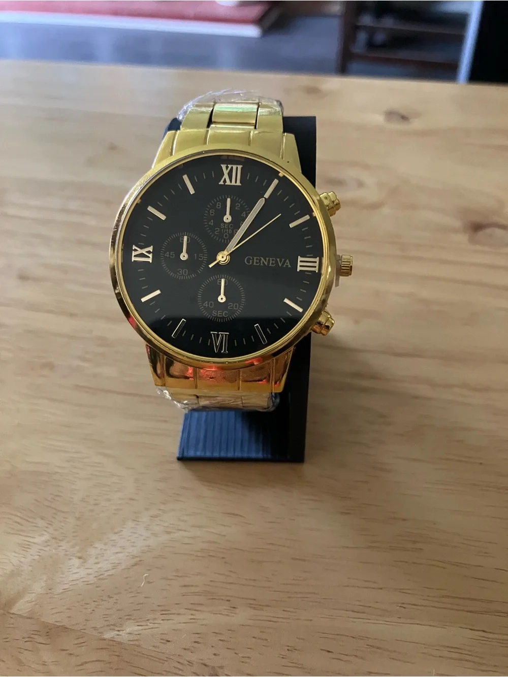 Geneva Gold Tone Watch with Black Dial